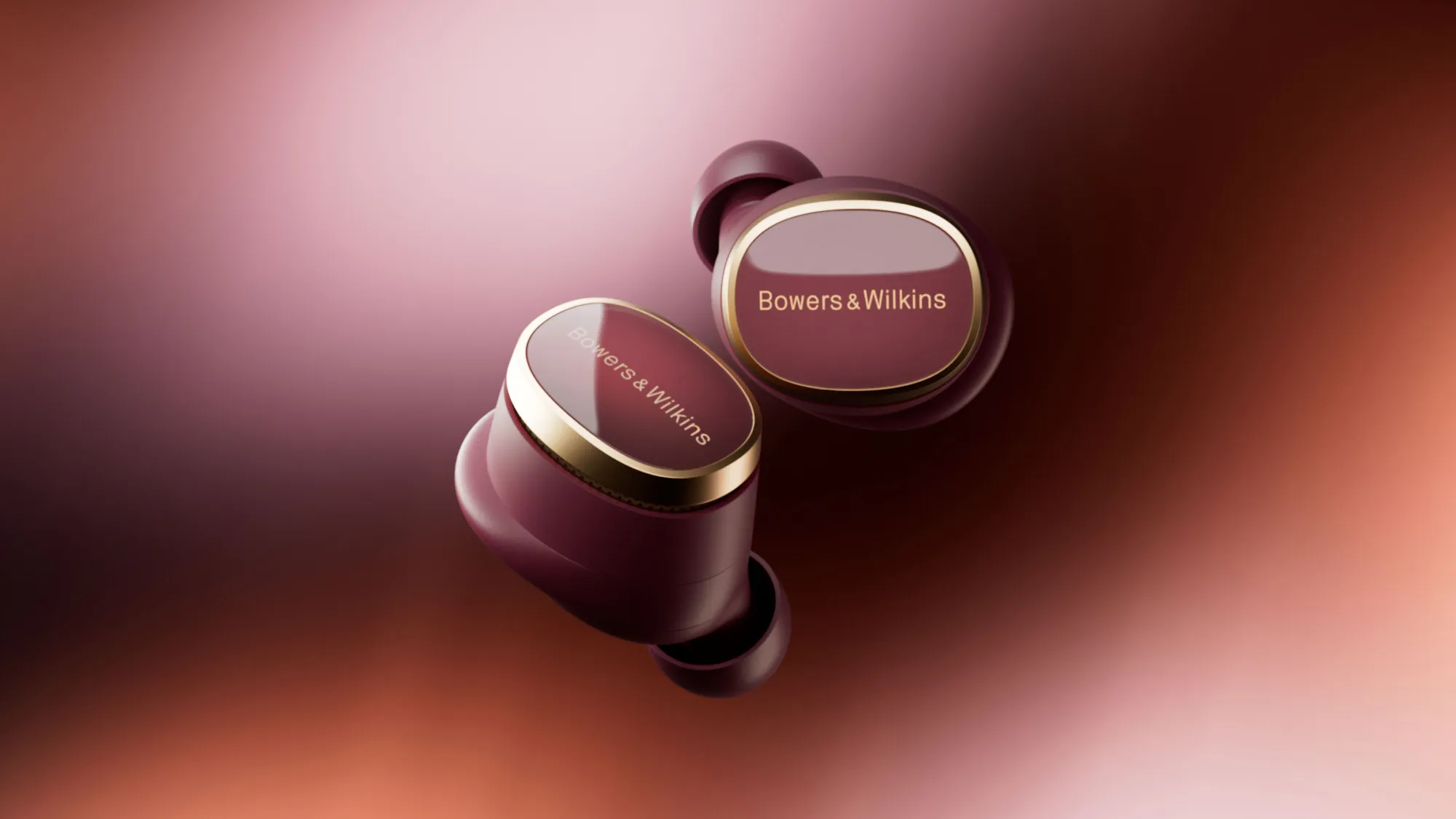 Bowers &amp; Wilkins Pi8 in dark burgundy on a burgundy background
