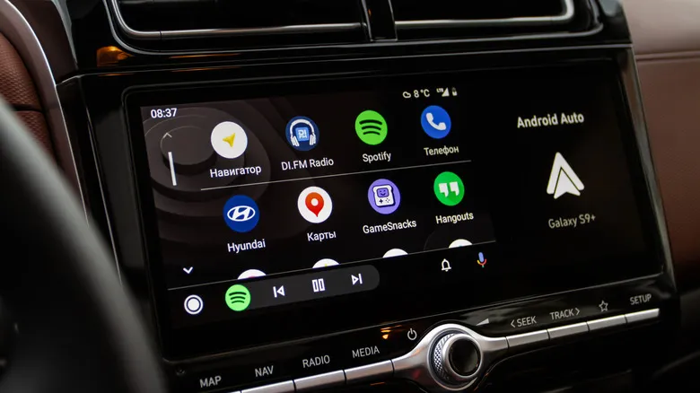 A vehicle's infotainment display showing Android Auto, there are two rows of icons featuring various apps