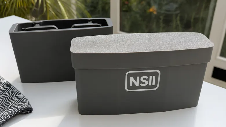 Nintendo Switch 2 storage case on a table with detachable inner compartments.
