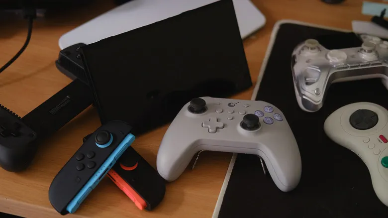 Controllers surrounding Switch 2 on desk