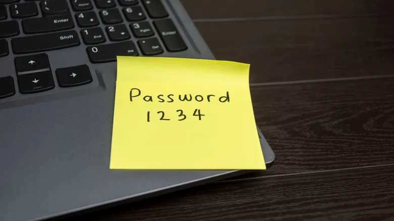 A sticky note with Password 1234 written on it
