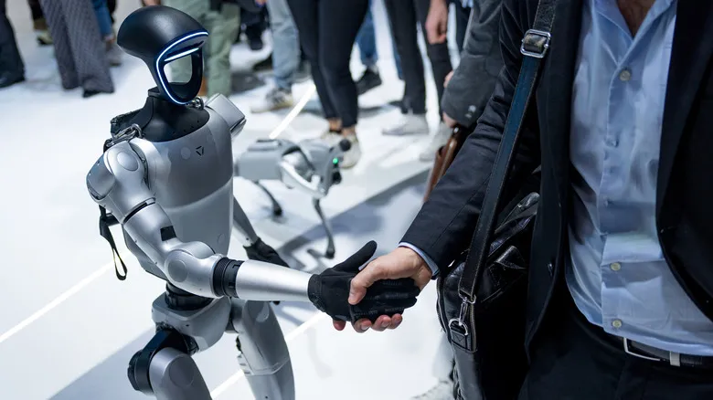 Unitree G1 robot shaking hands with someone