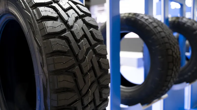 Close up of winter profile treads on a tire.