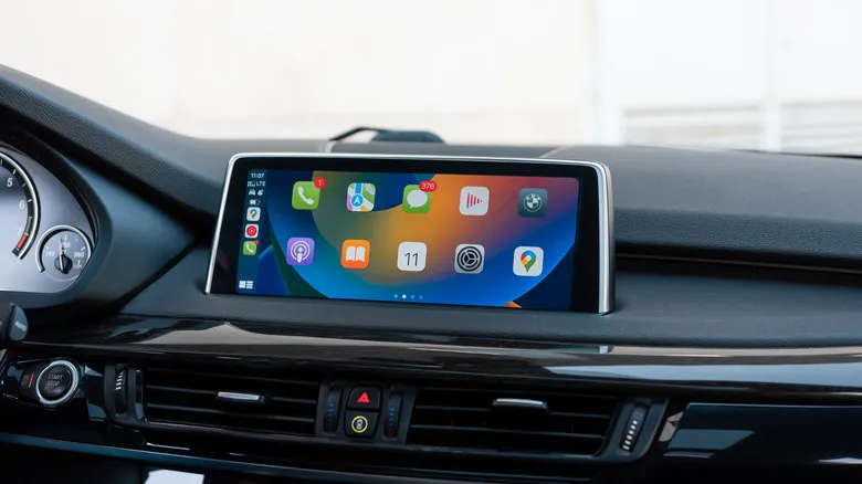 An Apple CarPlay screen showing various apps, including Google Maps