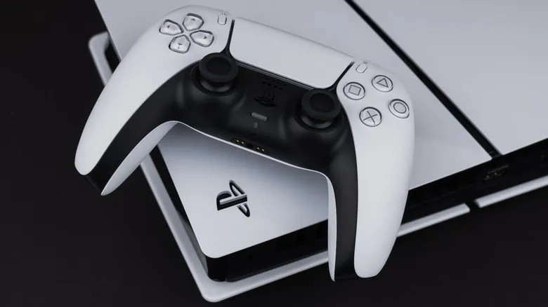 DualSense controller resting on top of a PlayStation 5 console.