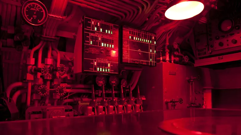 The interior of a submarine in red light