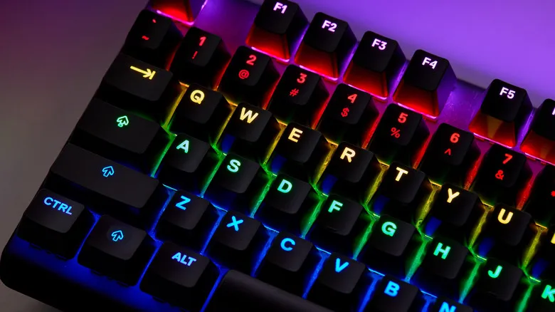 An illuminated RGB QWERTY keyboard, showcasing its red, yellow, green, and blue colors