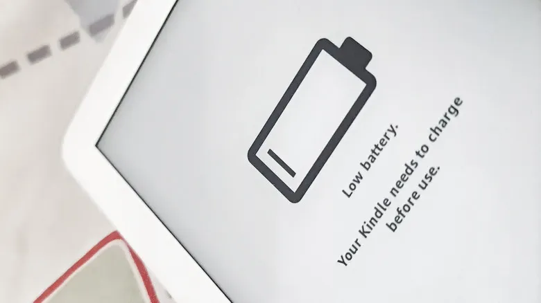 A low battery icon on the screen of a Kindle e-reader.
